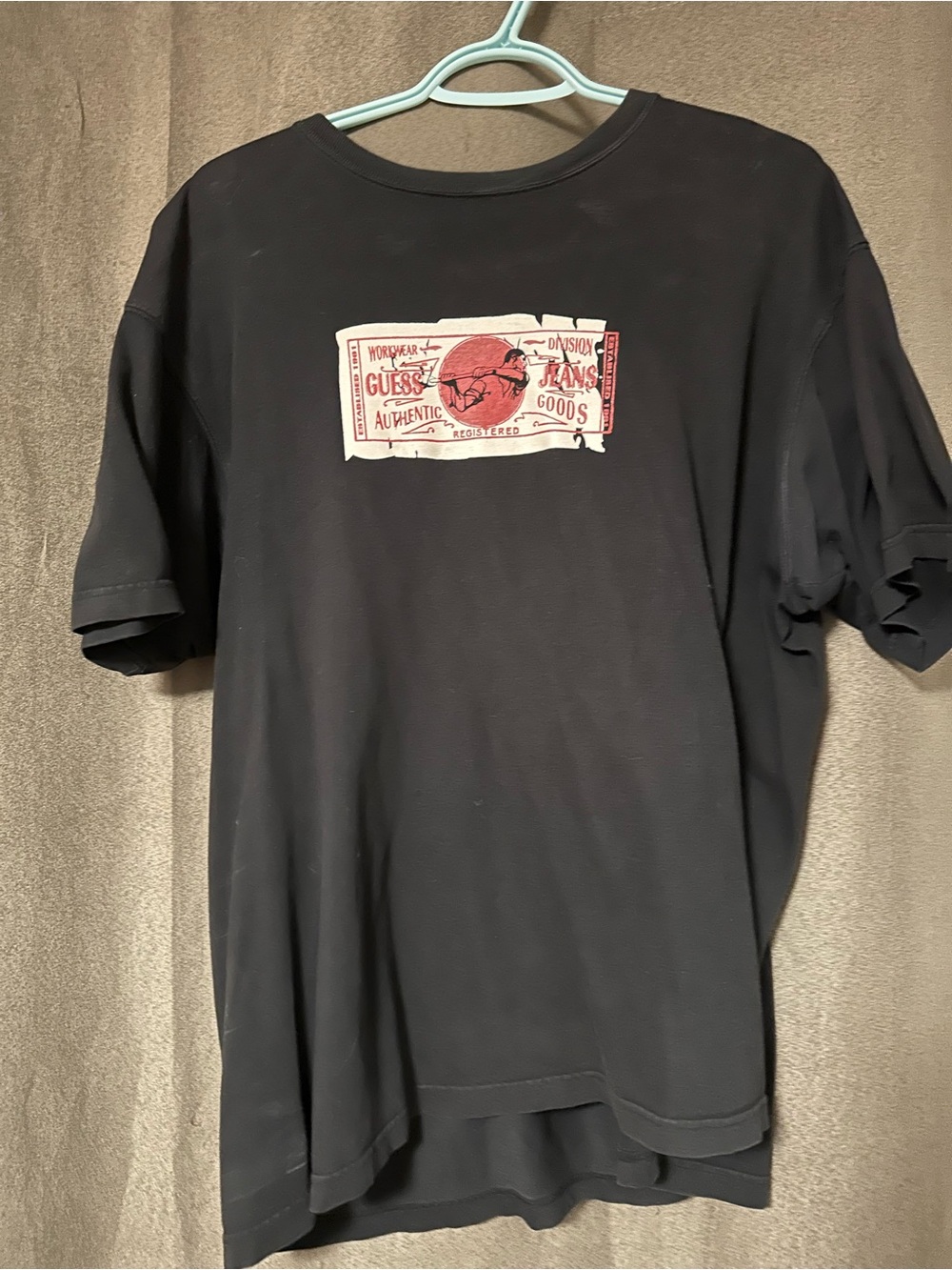 Guess Black Short-Sleeve Tee with Red and White Label Graphic